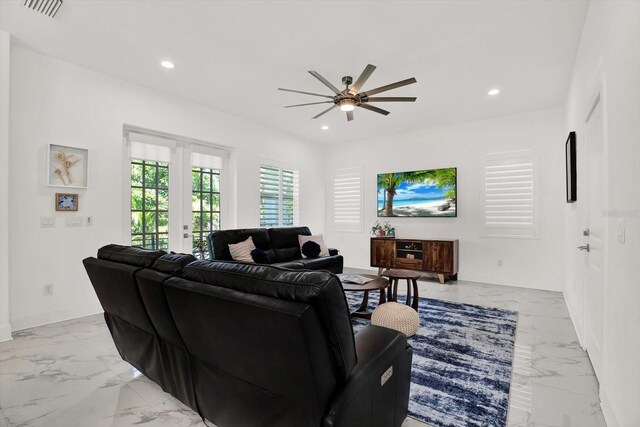 5006 W Idaho St, Tampa, FL 33616 - living area with light marble finish floors, a ceiling fan, and recessed lighting