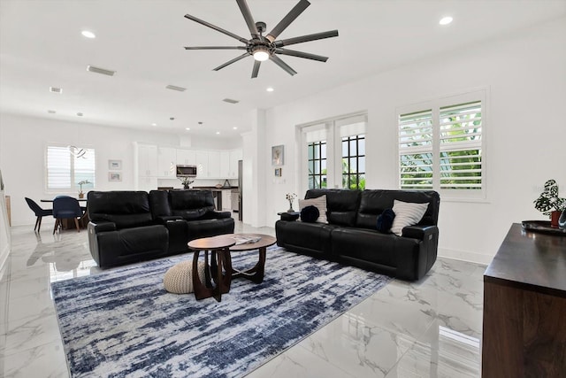 5006 W Idaho St, Tampa, FL 33616 - living area with light marble finish floors, ceiling fan, and recessed lighting