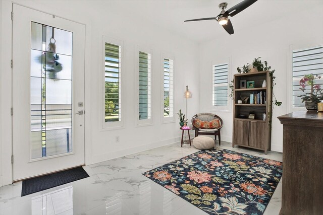 5006 W Idaho St, Tampa, FL 33616 - foyer with marble look tile flooring and ceiling fan