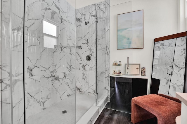 5006 W Idaho St, Tampa, FL 33616 - bathroom with a marble finish shower, vanity, and wood finished floors