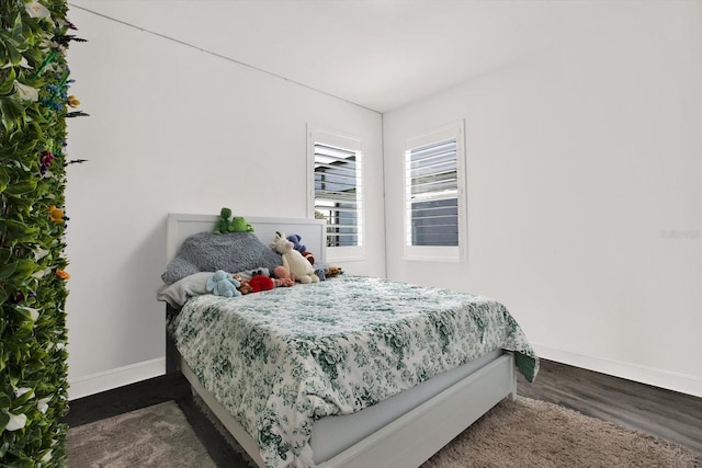 5006 W Idaho St, Tampa, FL 33616 - bedroom with baseboards and dark wood-style floors