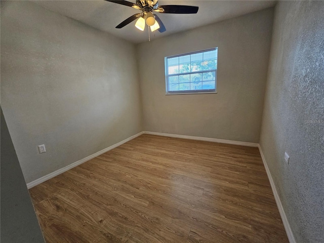 7001 60th St N, Pinellas Park, FL 33781 - spare room featuring wood finished floors, ceiling fan, and a textured wall