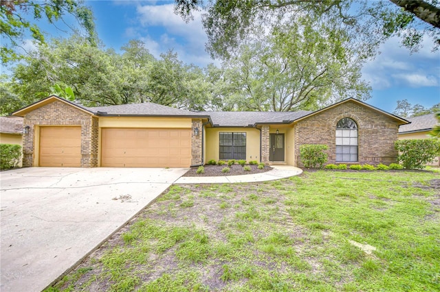 512 Pinewalk Dr, Brandon, FL 33510 - view of front of property with a garage, concrete driveway, brick siding, a front lawn, and a shingled roof