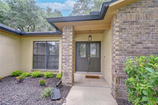 512 Pinewalk Dr, Brandon, FL 33510 - view of exterior entry featuring stucco siding