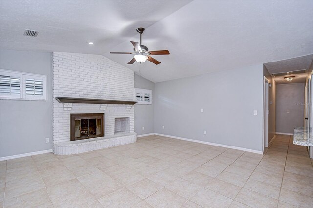 512 Pinewalk Dr, Brandon, FL 33510 - unfurnished living room with a ceiling fan, vaulted ceiling, a fireplace, and light tile patterned floors