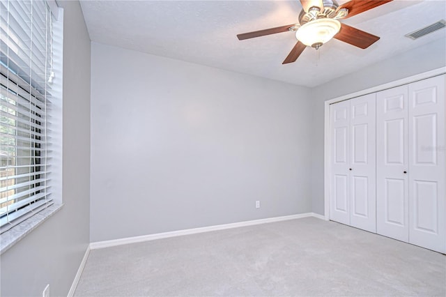 512 Pinewalk Dr, Brandon, FL 33510 - unfurnished bedroom with carpet, a closet, and ceiling fan
