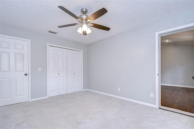 512 Pinewalk Dr, Brandon, FL 33510 - unfurnished bedroom with a closet, carpet, and a ceiling fan