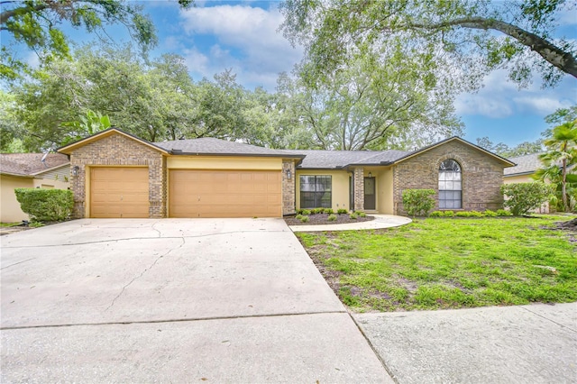512 Pinewalk Dr, Brandon, FL 33510 - mid-century inspired home with an attached garage, concrete driveway, a front yard, and brick siding
