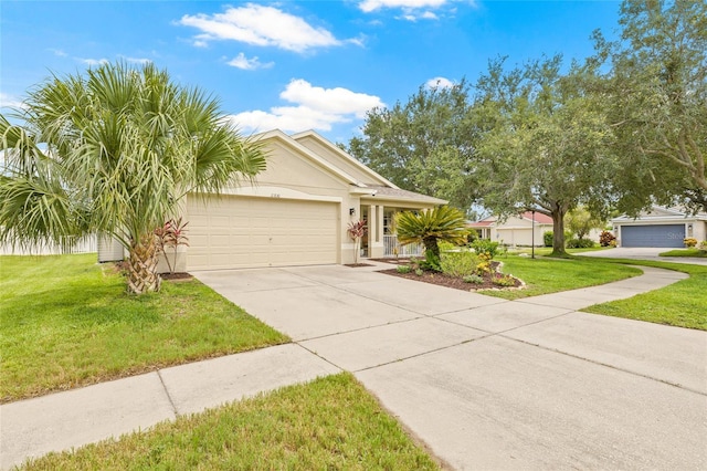 11830 Autumn Creek Dr, Riverview, FL 33569 - single story home with driveway, a front lawn, a garage, and stucco siding