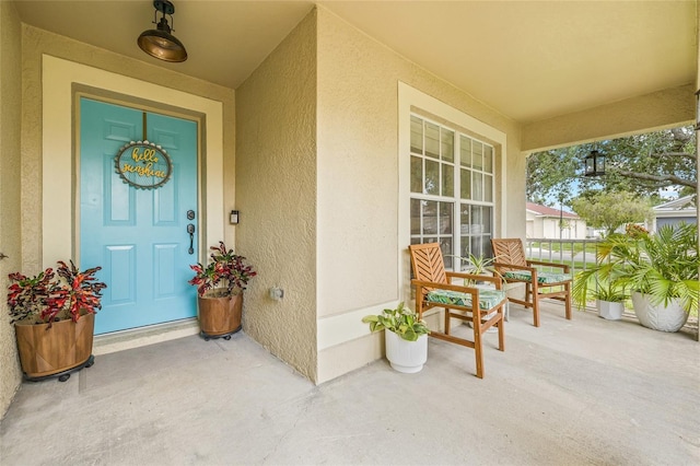 11830 Autumn Creek Dr, Riverview, FL 33569 - entrance to property with a porch and stucco siding