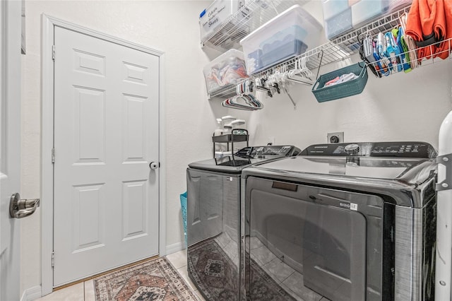 11830 Autumn Creek Dr, Riverview, FL 33569 - washroom with washer and clothes dryer and light tile patterned floors