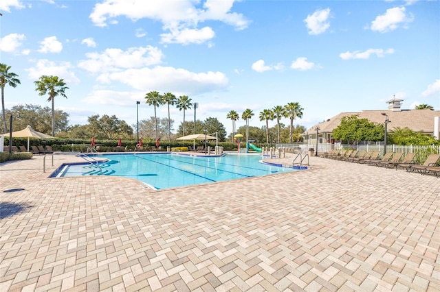 11830 Autumn Creek Dr, Riverview, FL 33569 - community pool with a patio area and a water slide