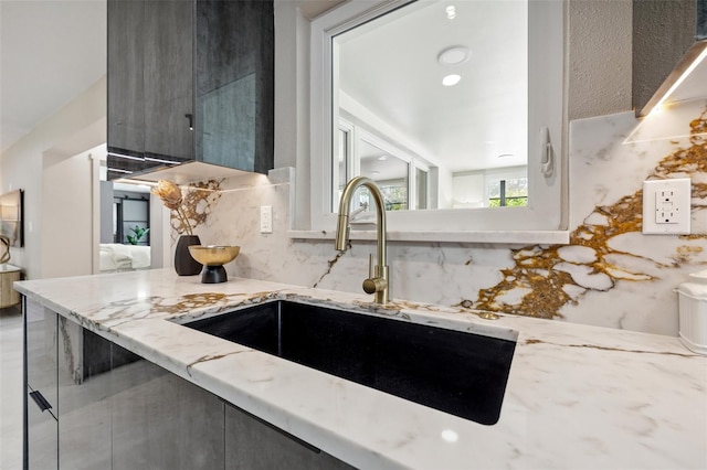 3197 Walnut St NE, Saint Petersburg, FL 33704 - kitchen featuring decorative backsplash, light stone countertops, gray cabinets, and modern cabinets
