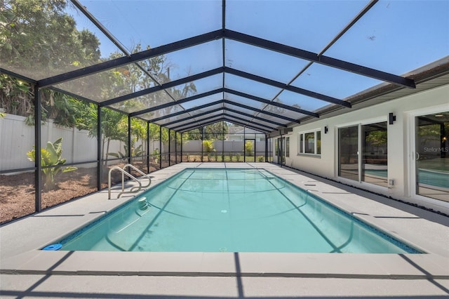 3197 Walnut St NE, Saint Petersburg, FL 33704 - view of swimming pool featuring a fenced backyard, a patio, and glass enclosure