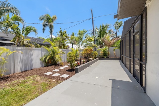3197 Walnut St NE, Saint Petersburg, FL 33704 - fenced backyard with a patio area