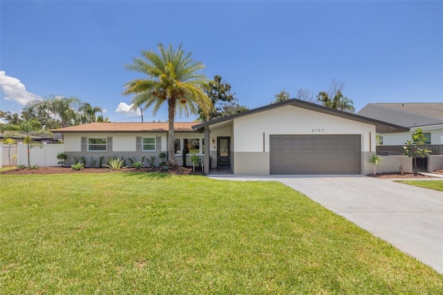 3197 Walnut St NE, Saint Petersburg, FL 33704 - single story home featuring an attached garage, driveway, and stucco siding