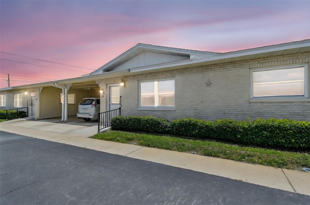 12400 Park Blvd Unit 519, Seminole, FL 33772 - single story home featuring an attached carport, brick siding, and concrete driveway