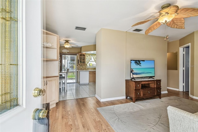 12400 Park Blvd Unit 519, Seminole, FL 33772 - living area featuring a ceiling fan and light wood finished floors