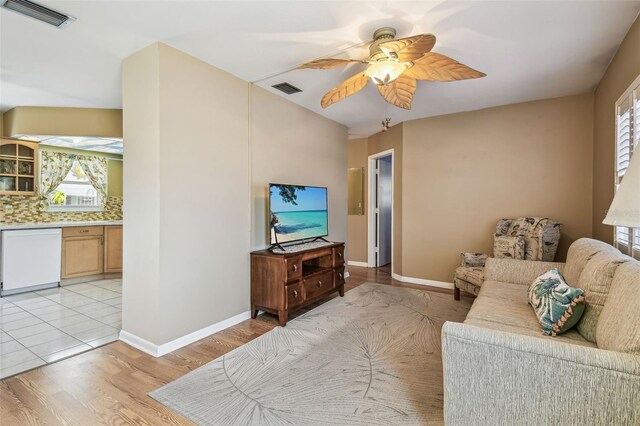 12400 Park Blvd Unit 519, Seminole, FL 33772 - living area with ceiling fan, light wood-style flooring, and plenty of natural light
