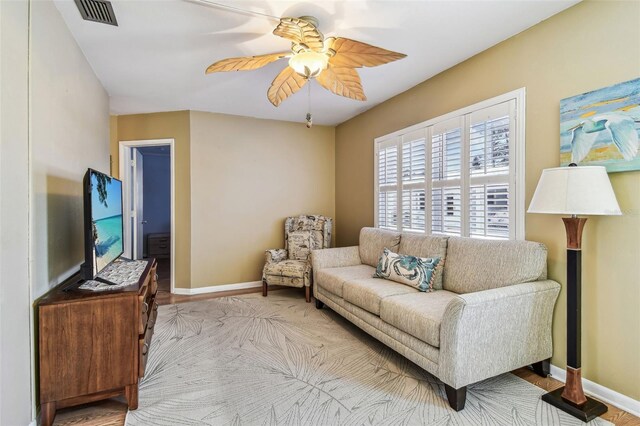 12400 Park Blvd Unit 519, Seminole, FL 33772 - living area featuring ceiling fan and baseboards