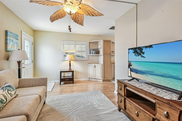 12400 Park Blvd Unit 519, Seminole, FL 33772 - living area with light wood-style flooring, ceiling fan, and healthy amount of natural light