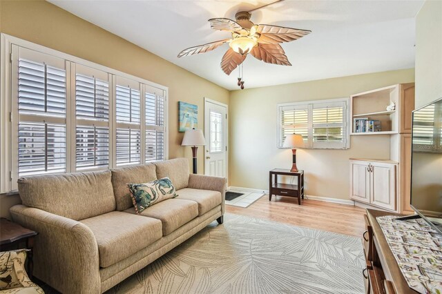 12400 Park Blvd Unit 519, Seminole, FL 33772 - living room featuring a ceiling fan and wood finished floors