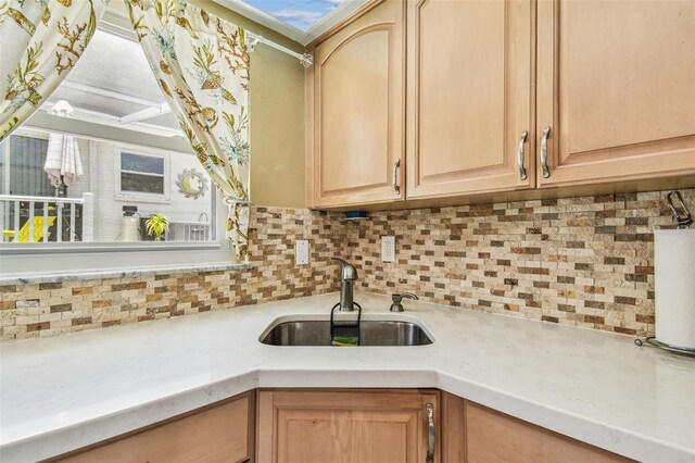 12400 Park Blvd Unit 519, Seminole, FL 33772 - kitchen with light brown cabinets, light countertops, and backsplash