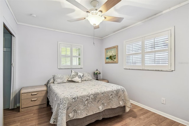12400 Park Blvd Unit 519, Seminole, FL 33772 - bedroom with wood finished floors, ornamental molding, and a ceiling fan