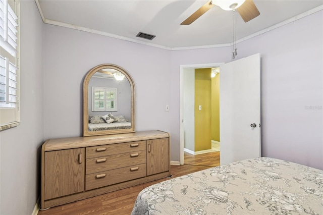 12400 Park Blvd Unit 519, Seminole, FL 33772 - bedroom featuring ornamental molding, wood finished floors, and ceiling fan