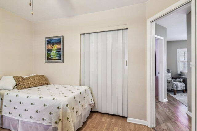 12400 Park Blvd Unit 519, Seminole, FL 33772 - bedroom featuring light wood-type flooring and baseboards