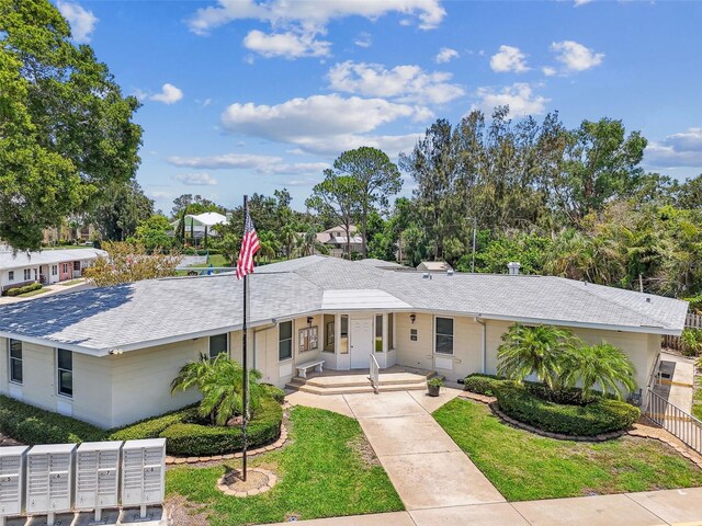 12400 Park Blvd Unit 519, Seminole, FL 33772 - ranch-style house featuring a shingled roof and stucco siding
