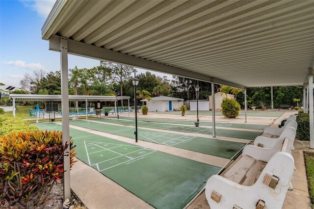 12400 Park Blvd Unit 519, Seminole, FL 33772 - view of community with shuffleboard and a storage unit