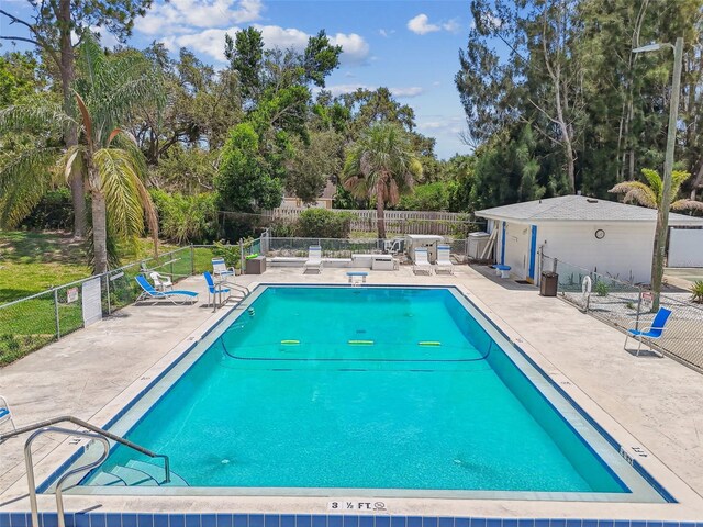 12400 Park Blvd Unit 519, Seminole, FL 33772 - community pool featuring a patio and view of scattered trees
