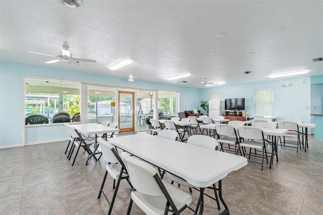 12400 Park Blvd Unit 519, Seminole, FL 33772 - dining room with ceiling fan and a textured ceiling