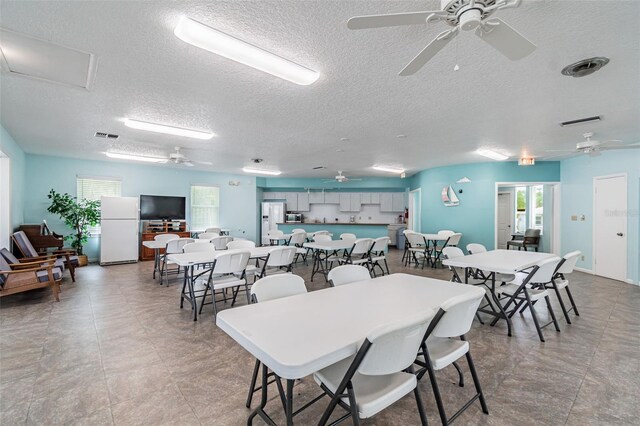 12400 Park Blvd Unit 519, Seminole, FL 33772 - dining space featuring ceiling fan and a textured ceiling