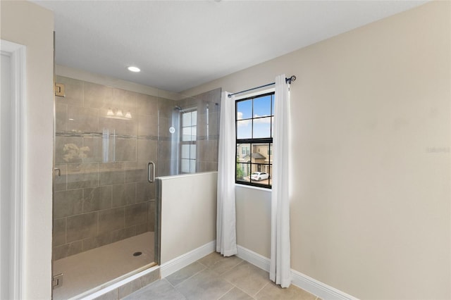 12821 Satin Lily Dr, Riverview, FL 33579 - bathroom featuring a stall shower, tile patterned flooring, and recessed lighting
