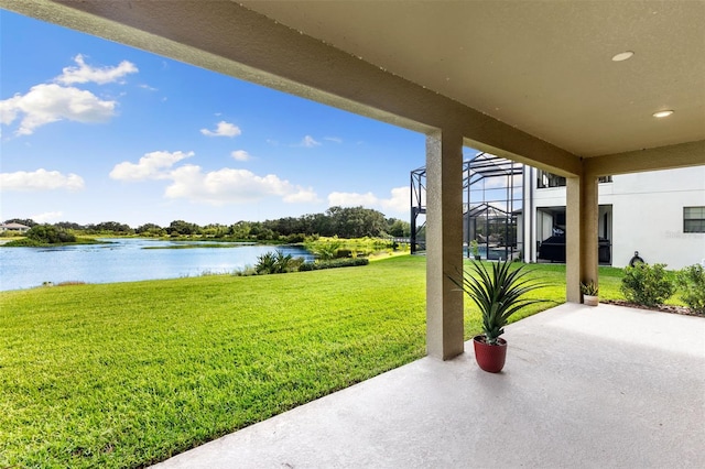 12821 Satin Lily Dr, Riverview, FL 33579 - view of grassy yard with a water view, a patio area, and a lanai