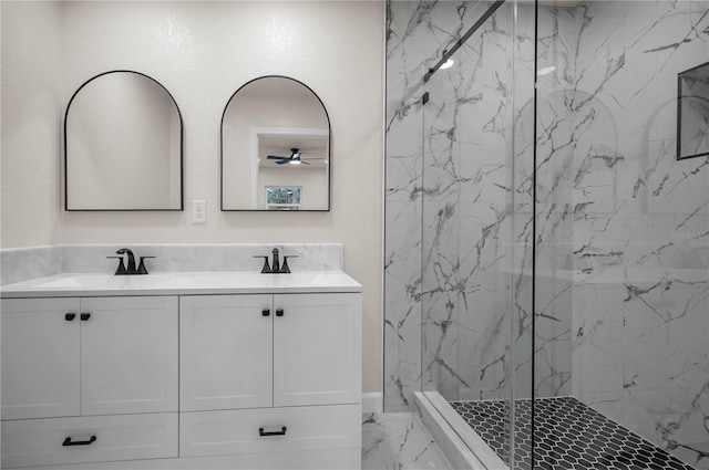 4441 16th St N, Saint Petersburg, FL 33703 - bathroom featuring marble look tile flooring, a marble finish shower, double vanity, and ceiling fan