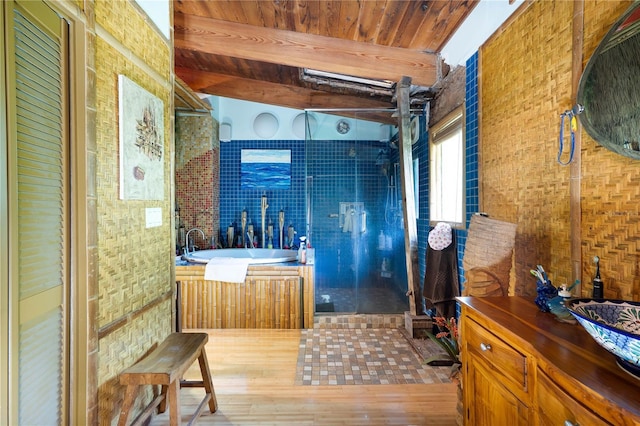 6924 Valrie Ln, Riverview, FL 33569 - bathroom featuring wood finished floors, a garden tub, a stall shower, a wooden ceiling with exposed beams, and vanity