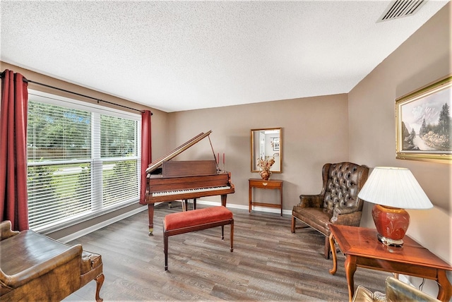 6709 Peachtree Dr, Temple Terrace, FL 33617 - sitting room with wood finished floors and a textured ceiling