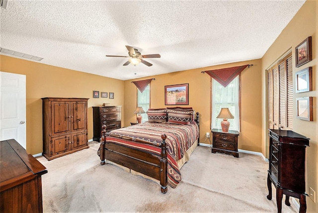 6709 Peachtree Dr, Temple Terrace, FL 33617 - bedroom featuring light carpet, ceiling fan, a textured ceiling, and a closet