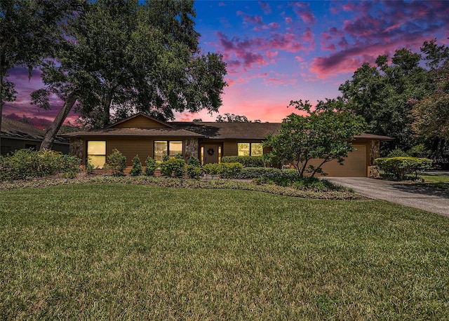 6709 Peachtree Dr, Temple Terrace, FL 33617 - ranch-style home with asphalt driveway, a garage, and a front yard
