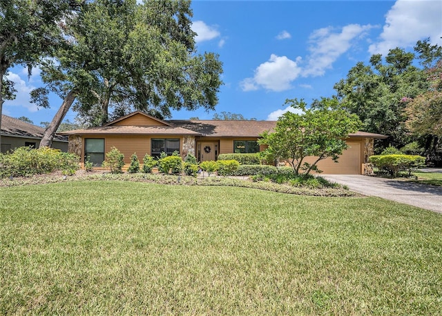 6709 Peachtree Dr, Temple Terrace, FL 33617 - single story home featuring an attached garage, driveway, and a front yard
