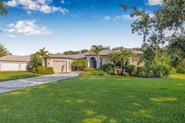 15420 27th Ct E, Parrish, FL 34219 - view of front of home with driveway, a front lawn, an attached garage, and stucco siding