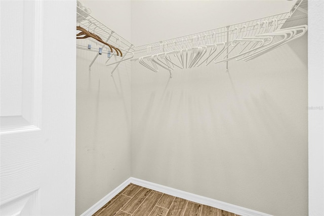 15420 27th Ct E, Parrish, FL 34219 - walk in closet featuring wood finished floors