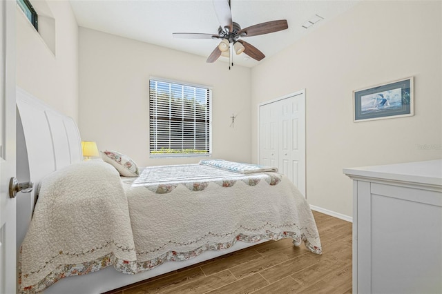 15420 27th Ct E, Parrish, FL 34219 - bedroom with wood finished floors, a closet, and a ceiling fan