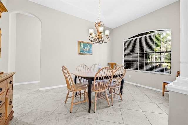 15420 27th Ct E, Parrish, FL 34219 - dining room featuring arched walkways, light tile patterned floors, and a chandelier