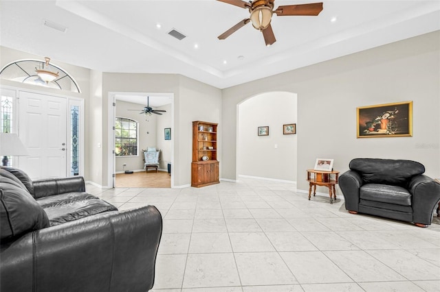 15420 27th Ct E, Parrish, FL 34219 - living area with a ceiling fan, light tile patterned flooring, a raised ceiling, recessed lighting, and arched walkways