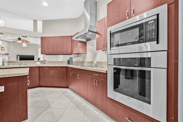 15420 27th Ct E, Parrish, FL 34219 - kitchen with wall chimney exhaust hood, stainless steel appliances, light countertops, light tile patterned floors, and ceiling fan