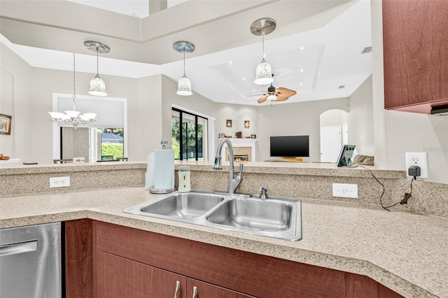 15420 27th Ct E, Parrish, FL 34219 - kitchen with dishwasher, a chandelier, light countertops, ceiling fan, and a raised ceiling